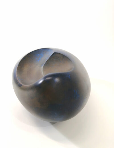 ovoid, cast gypsum with polymers, pigment, bronze, patina