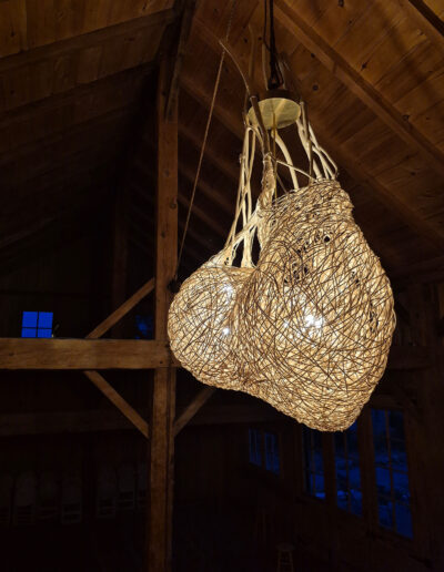 Woven light sculpture, reed, wood and a touch of brass